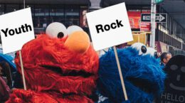 A picture of Sesame Street characters holding protest signs.