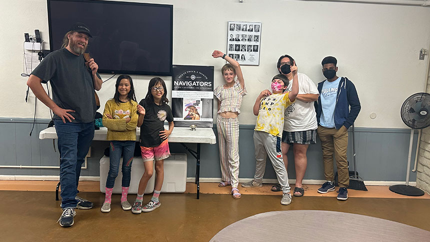 A group of UUCP kids posing for a photo in a classroom