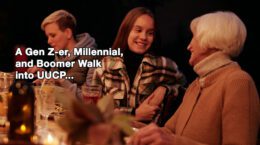 Three women from different generations sitting at a table together.