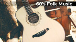 An acoustic guitar leaning up against a wooden chair